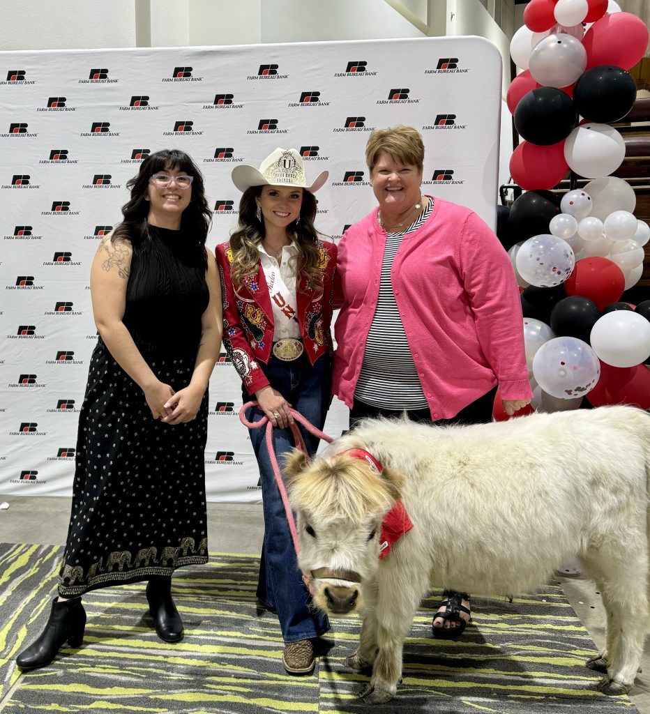 CDS Education Advisors Grace Vazquez and Rena Drake meet Kaili Lorelei Hill, Miss Rodeo America, and her mini cow, Sven.